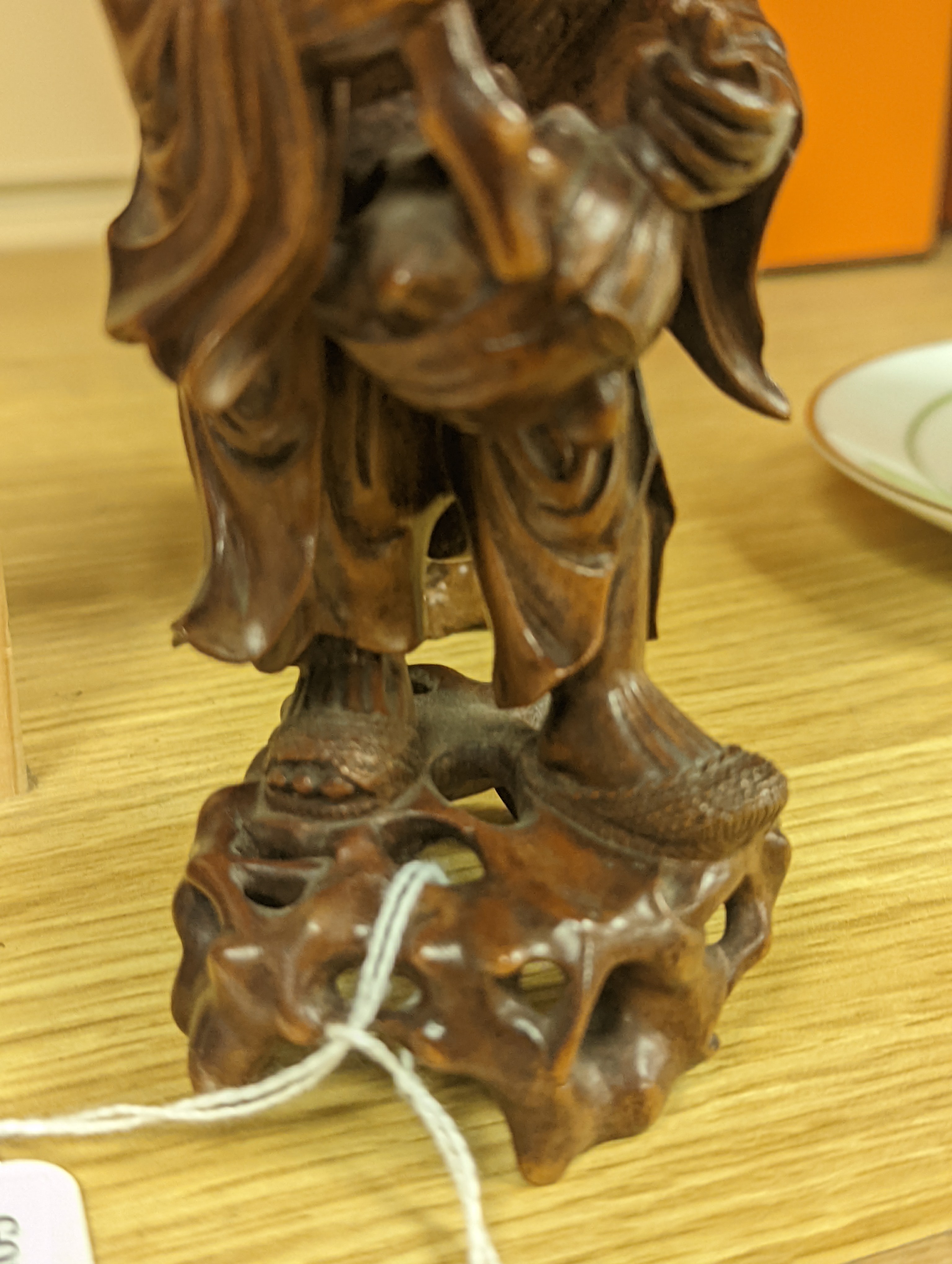 Two Chinese hardwood figures of a fisherman and a old man holding peaches 16cm